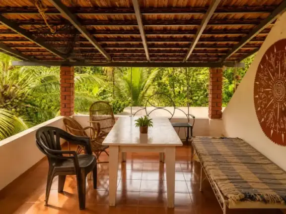 Covered dining patio overlooking the garden