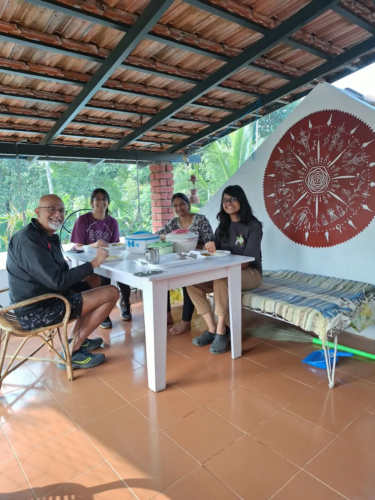 Guests at breakfast on the covered patio at Cheeral Green